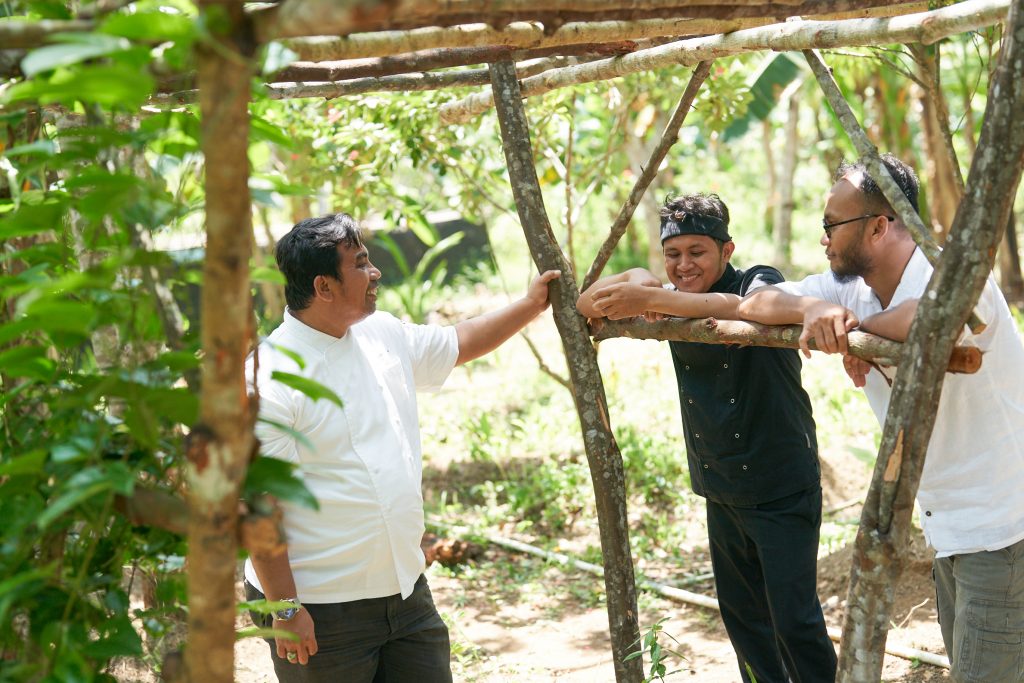 Chefs at the farm collecting ingredients